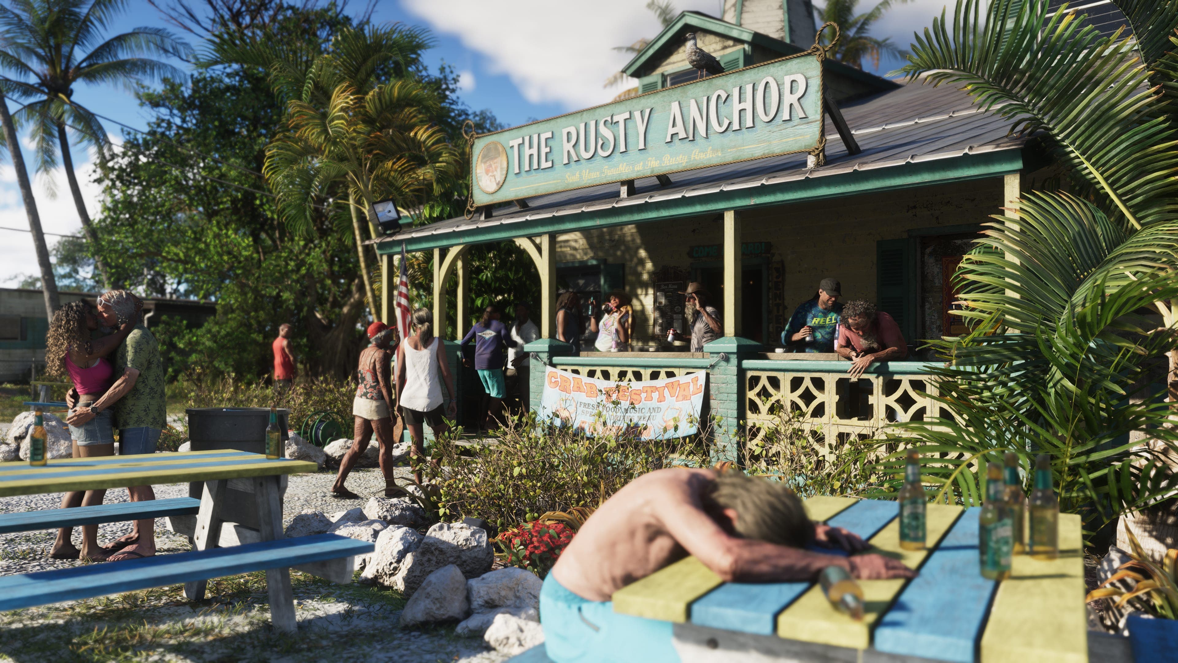Locals drink at picnic tables outside The Rusty Anchor bar in the Leonida Keys