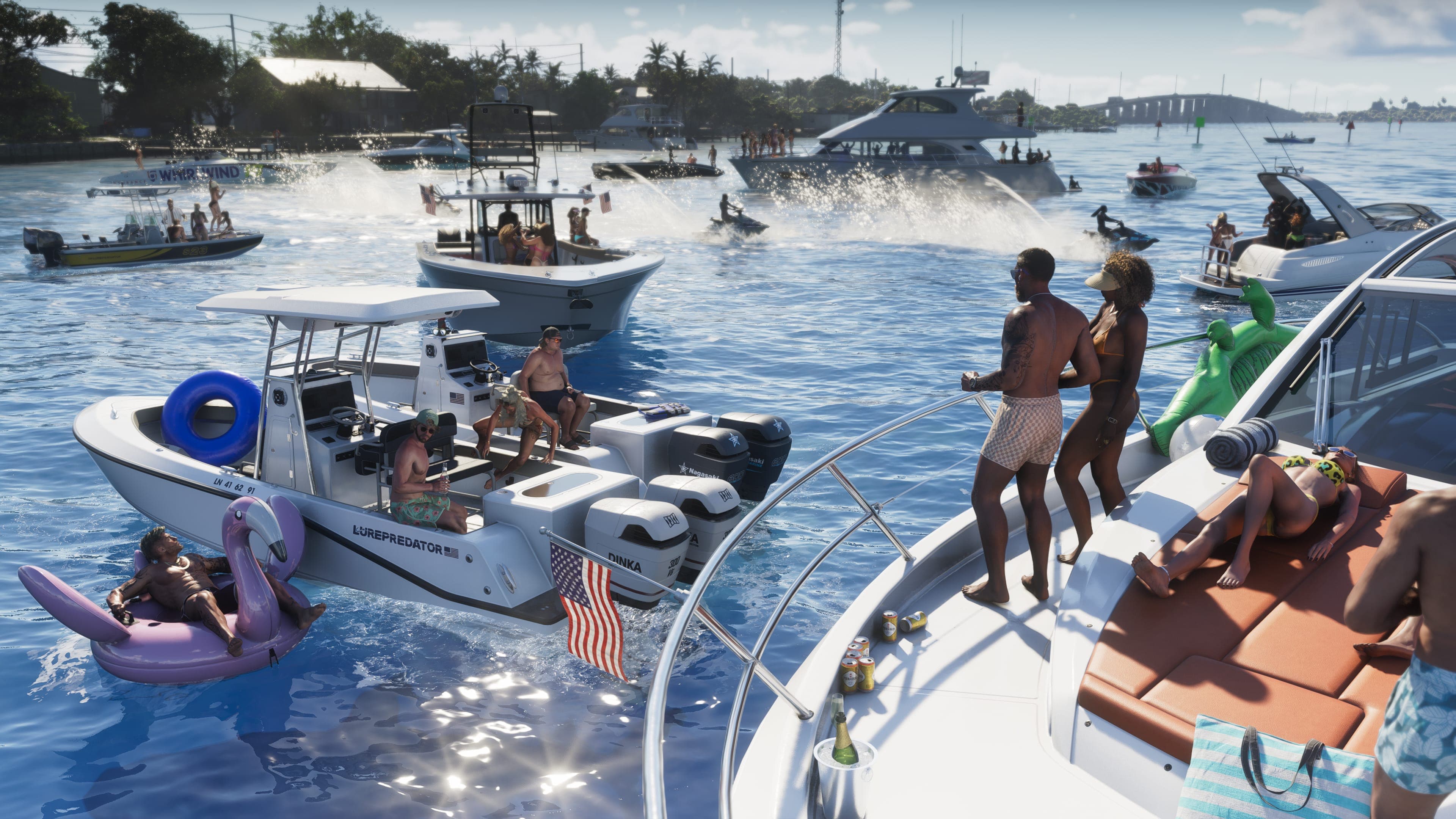 Boats and jet skis crowd a sandbar party in the Leonida Keys while people float on an inflatable flamingo
