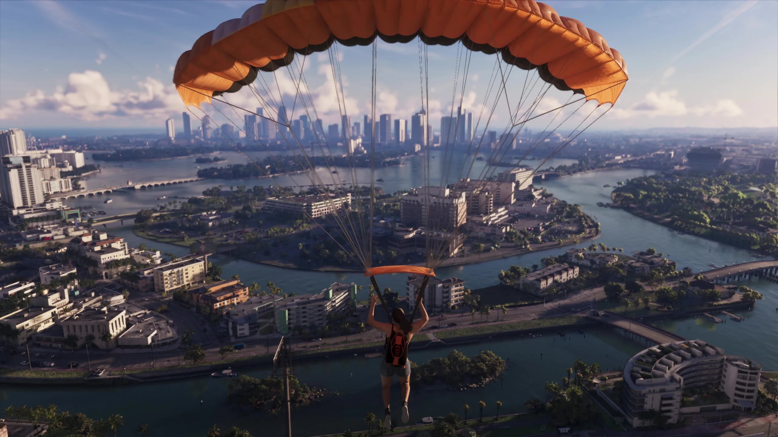 Lucia parachutes over the Vice City waterfront in the GTA 6 Extended Look. Official Rockstar Games footage.