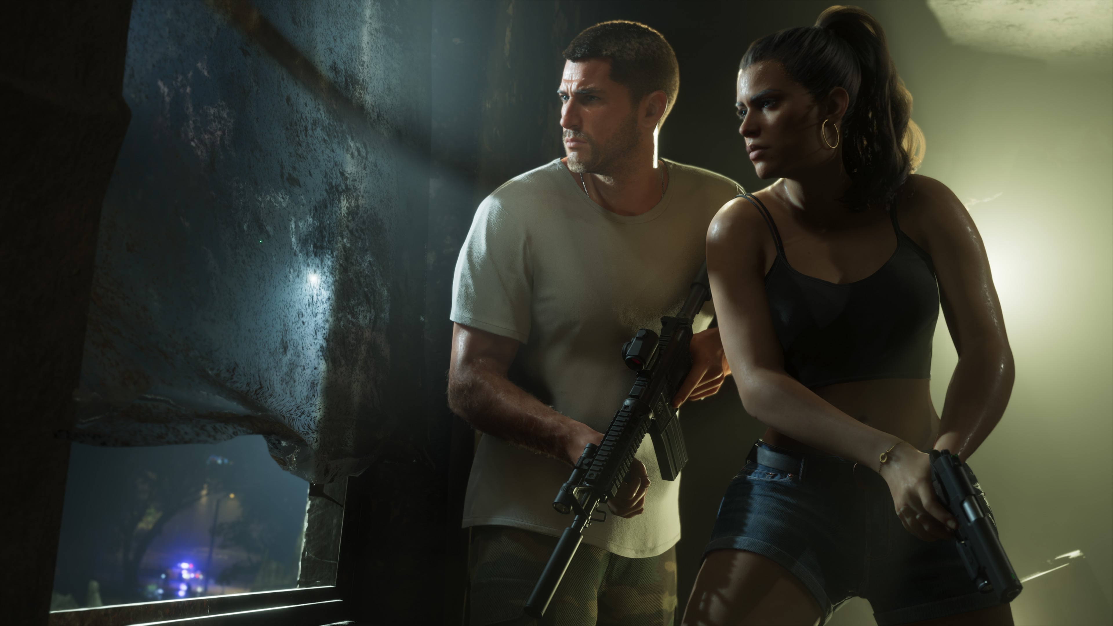Official GTA VI screenshot of Jason and Lucia carrying firearms beside a window, with police lights outside.