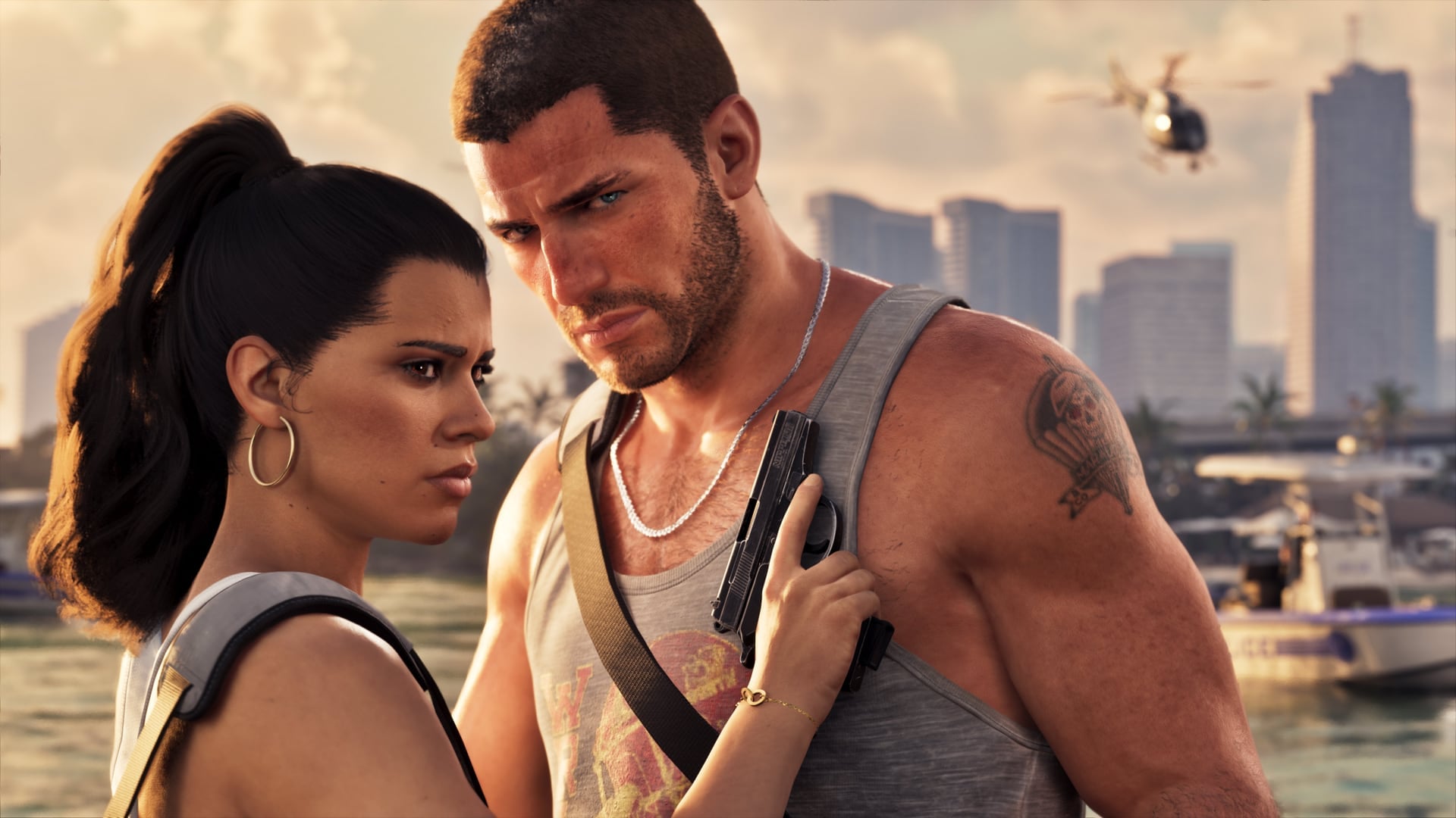 Jason and Lucia stand close together by the water with the Vice City skyline behind them, in an official Rockstar image