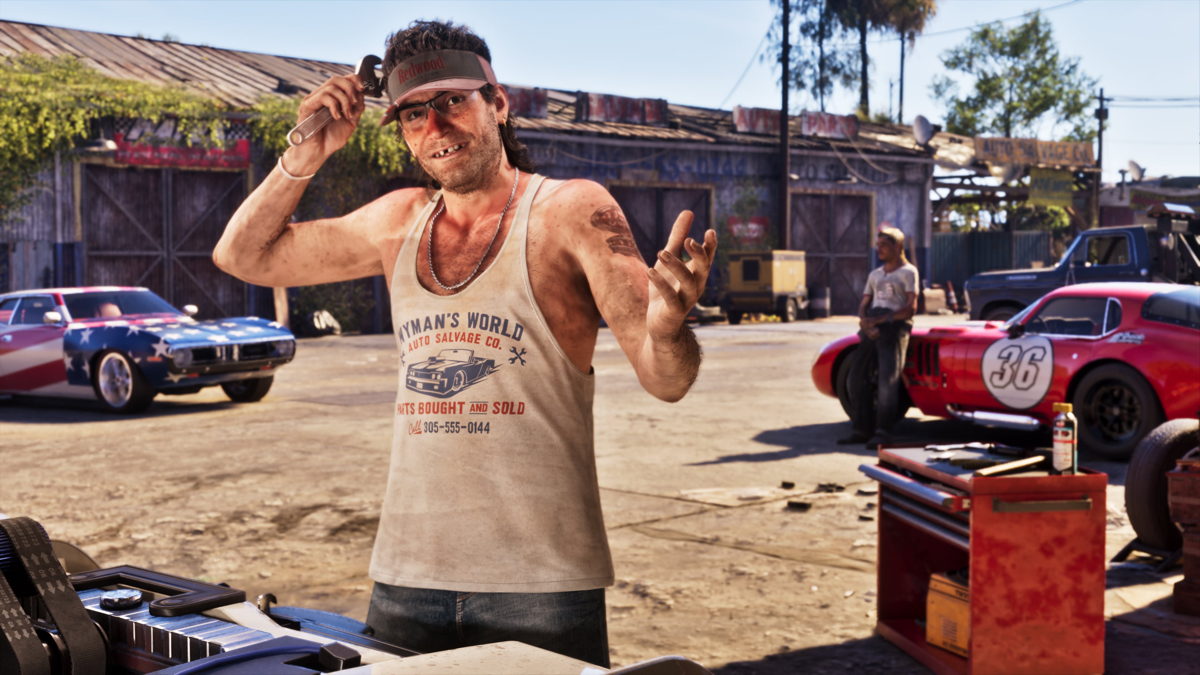 Wyman stands outside a garage with a wrench in an official Rockstar GTA VI screenshot.