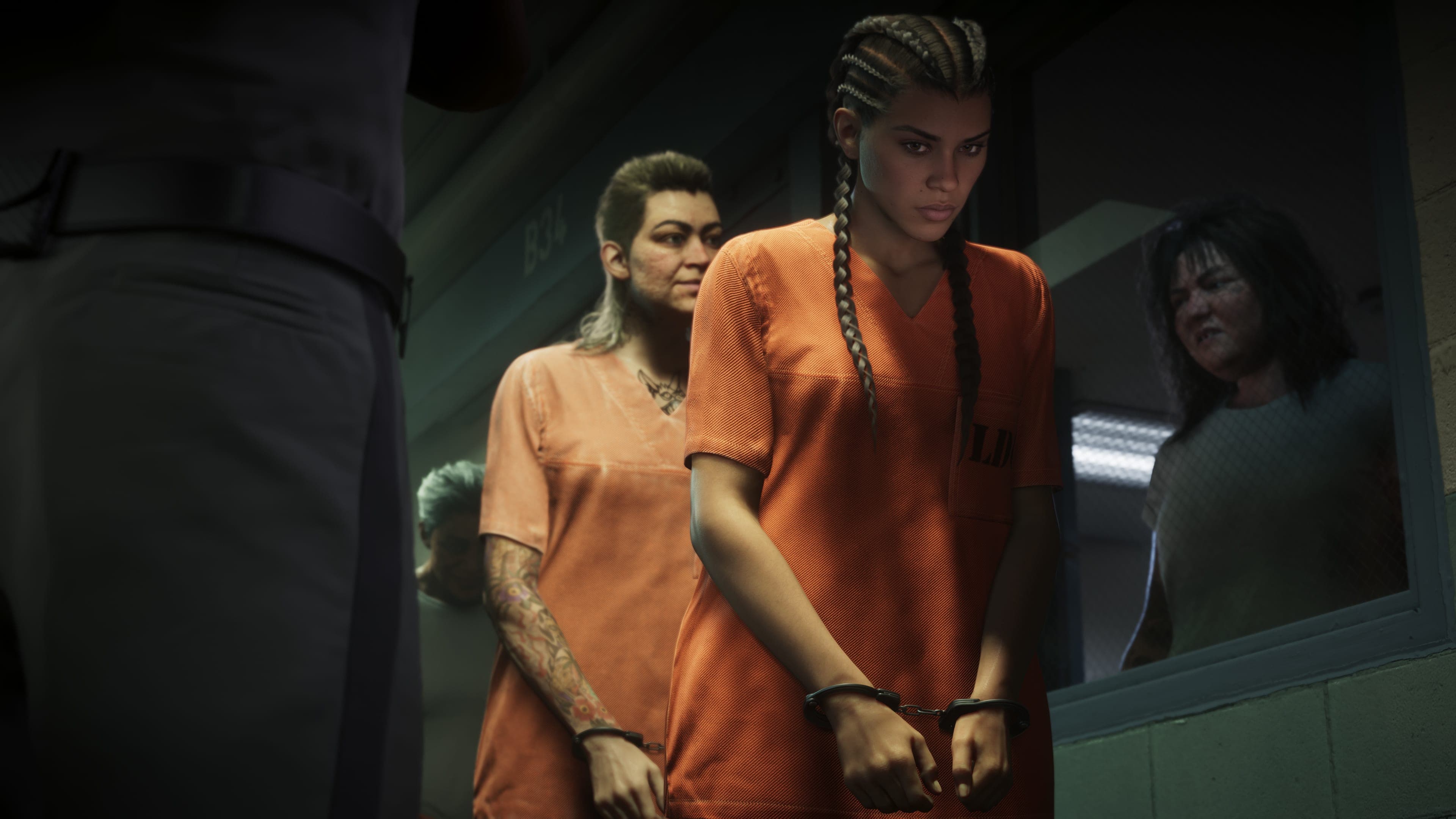 Lucia Caminos in an orange prison jumpsuit and handcuffs walks with other inmates