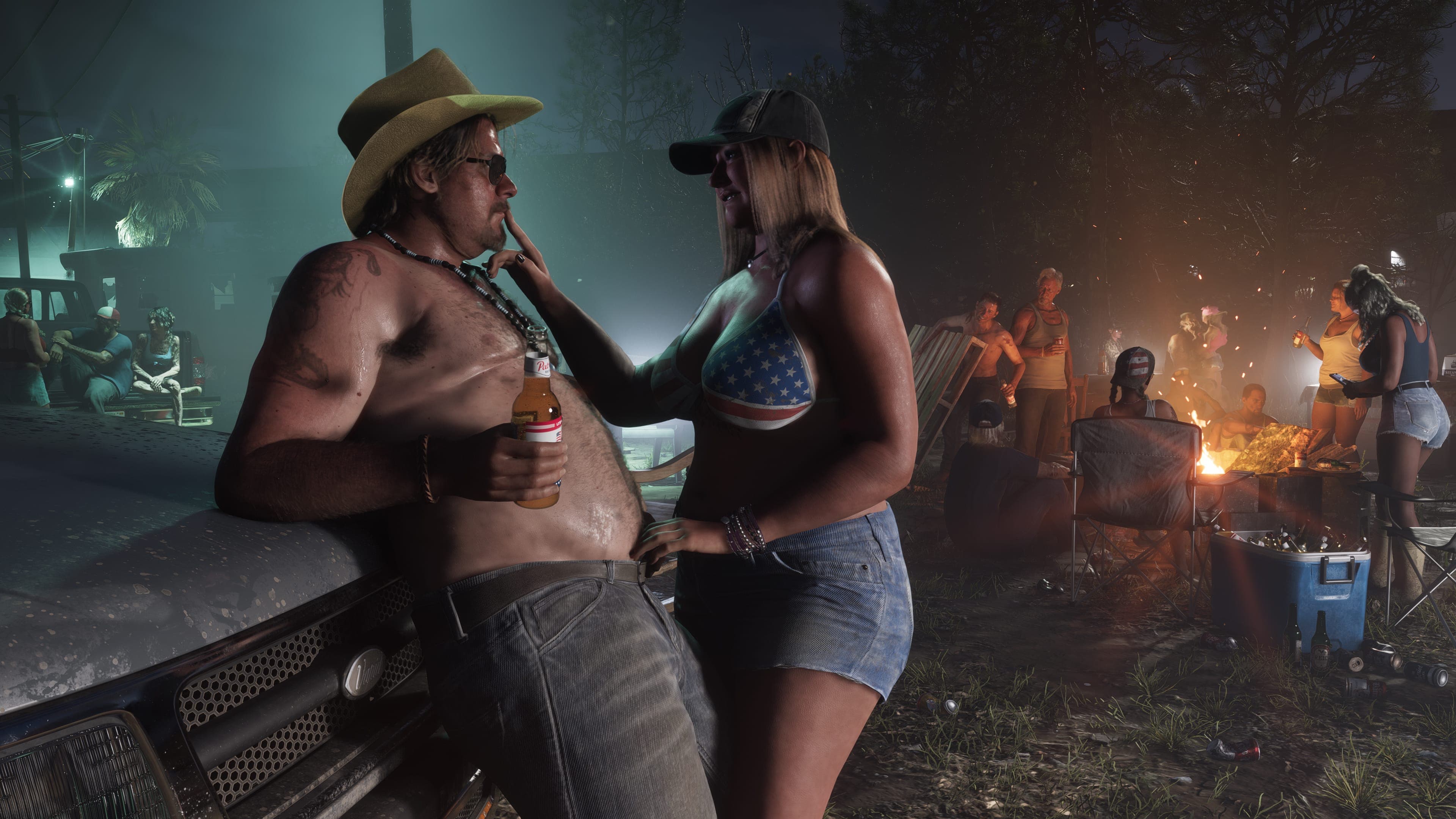 A shirtless man in a cowboy hat holds a beer as a woman leans in at a night bonfire party in Port Gellhorn