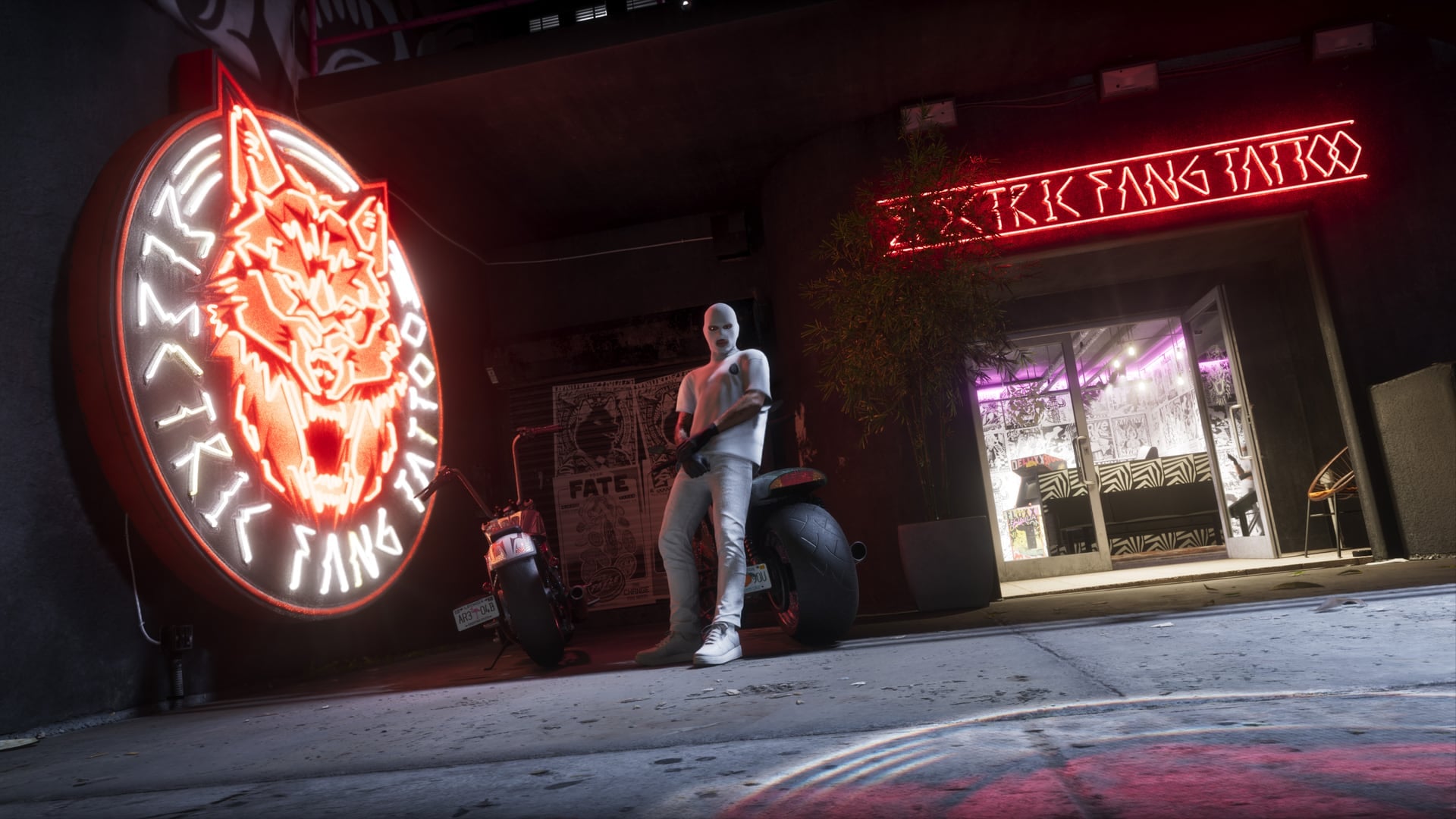 Fachada de neón nocturna del estudio de tatuajes Electric Fang Tattoo, el negocio de Stockyard que Rockstar muestra en el material de la Ultimate Edition.