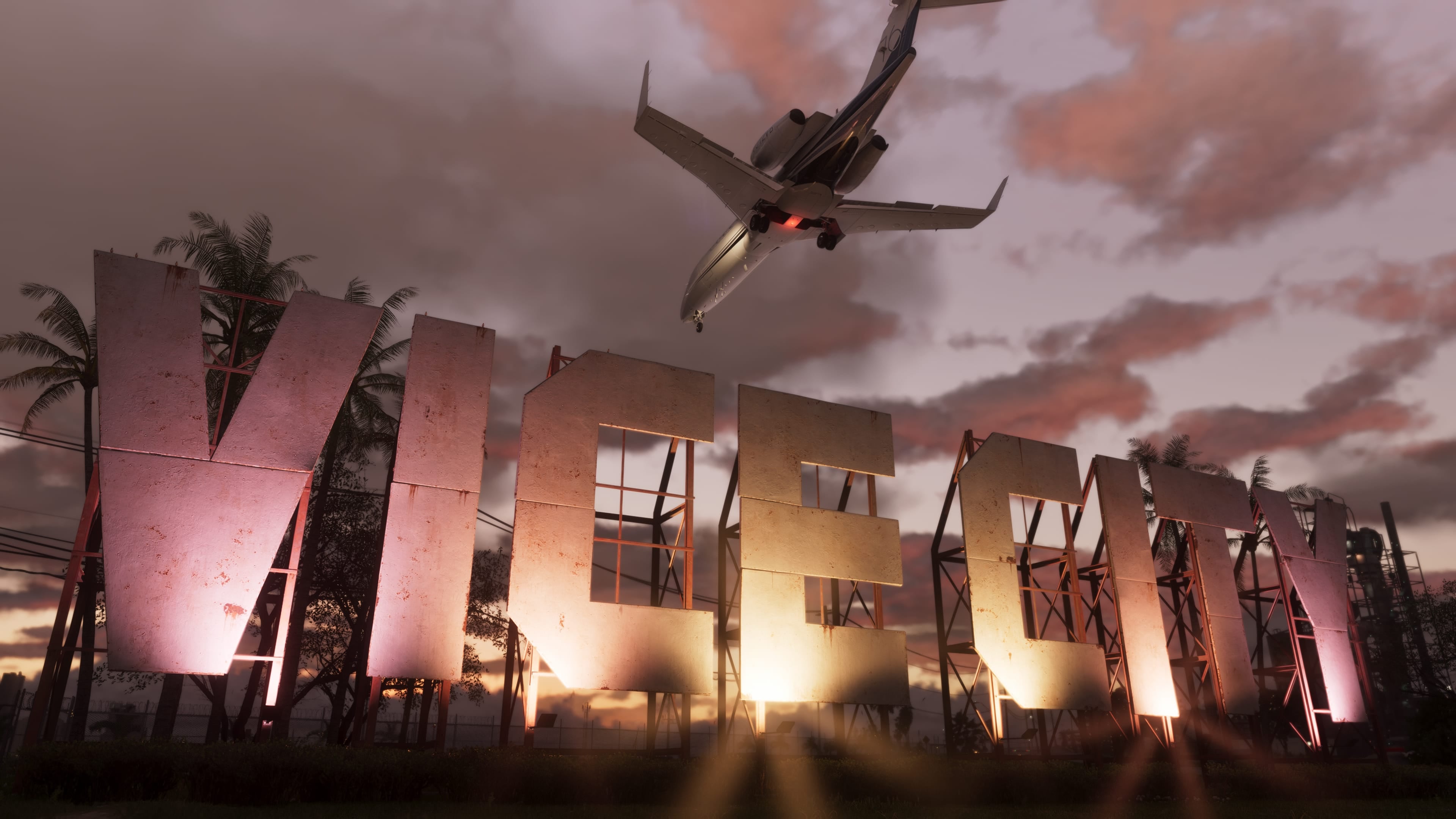 Official GTA VI image of a jet passing the Vice City sign at sunset.